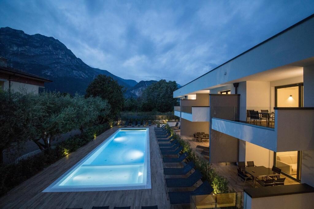 Riva Lake Lodge, pool and building with mountain views in Riva del Garda